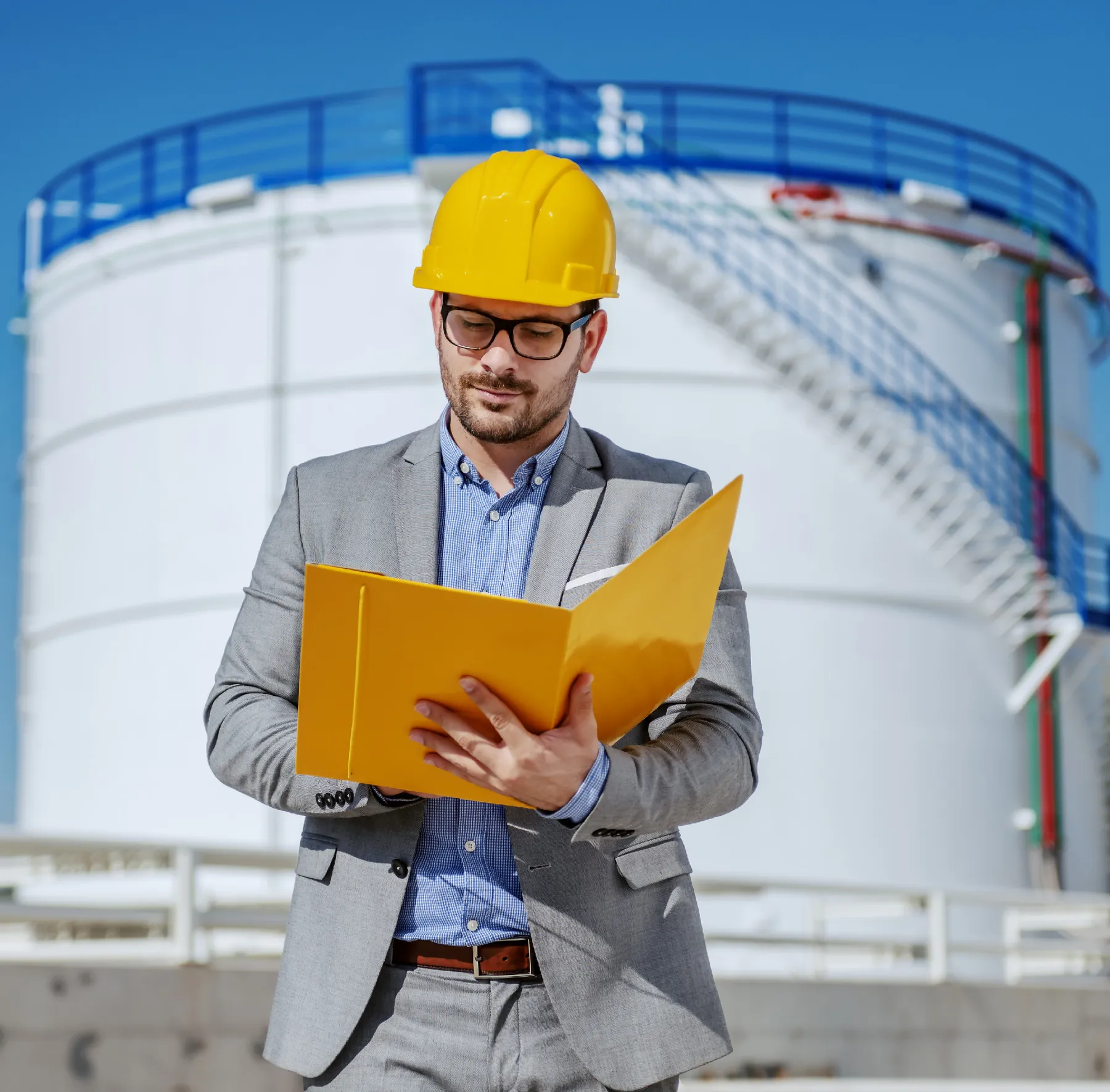 Man in suit with yellow hard hat